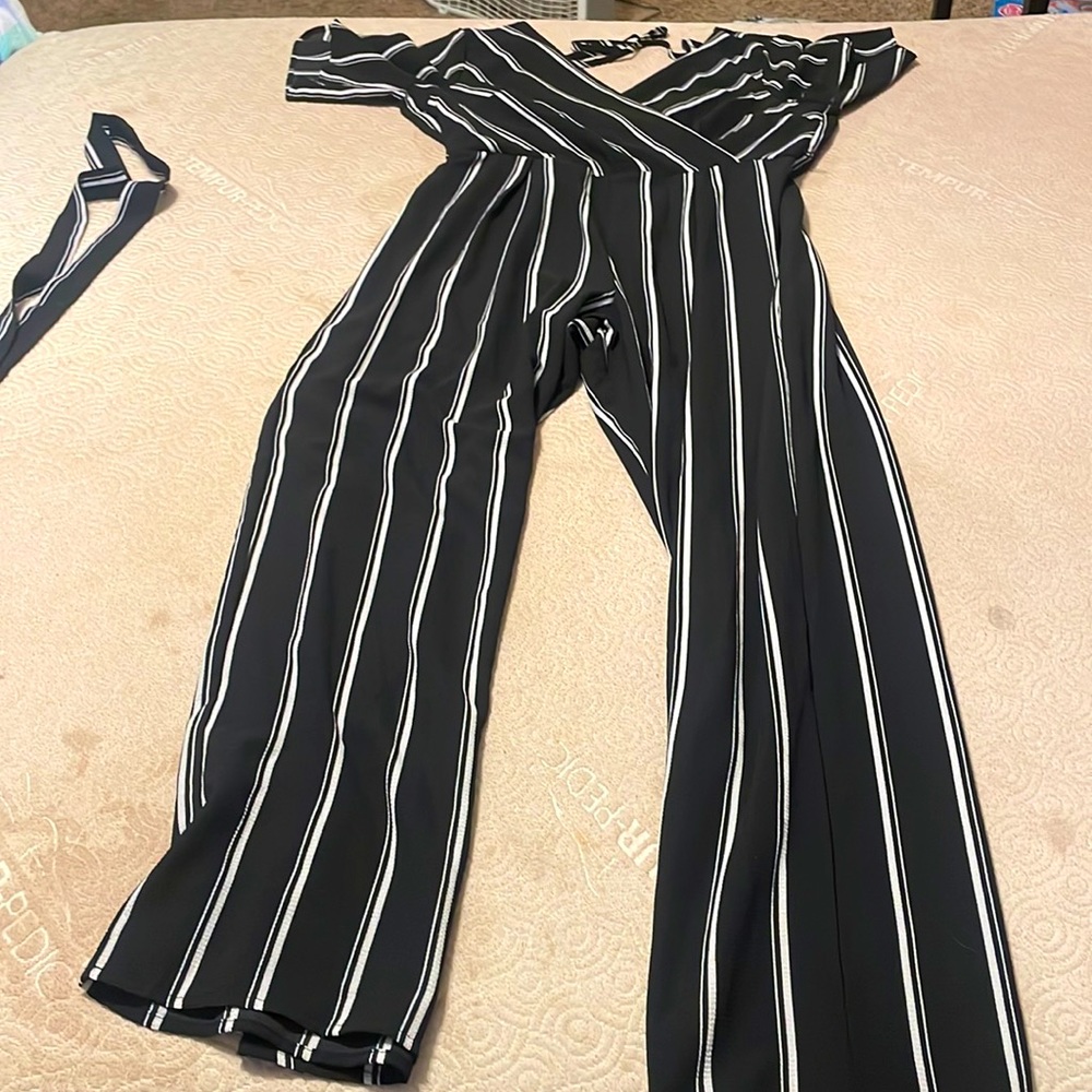 Only used once. The brand is Trixxi and it is a black and white XL romper.